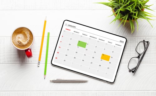 Preview: Tablet with calendar app, coffee cup and office supplies