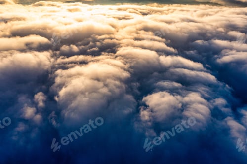 Preview: Thick layer of white clouds above mountains at sunrise