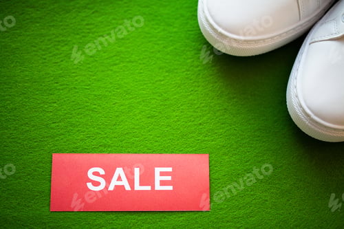 Preview: Stylish white fashion sneakers on gren background.