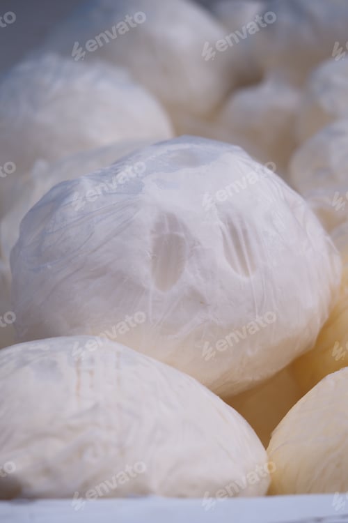 Preview: Delicate handmade cheese balls displayed for sale at local market