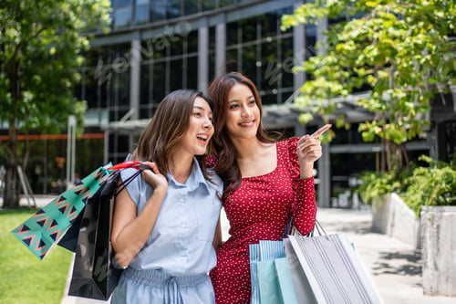 Preview: Asian beautiful two women shopping goods outdoor in department store.