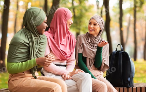 Preview: Three Muslim Arab Women Talking Sitting On Bench In Park