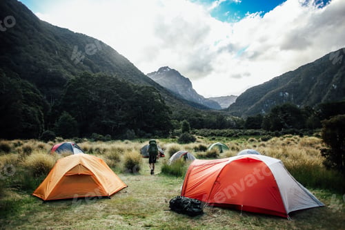 Preview: Scenic campsite in a lush mountain valley.