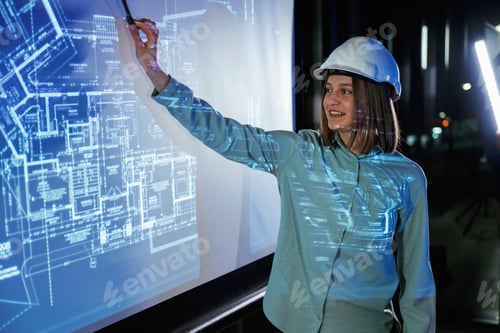 Preview: In white hard hat. Female architect is showing construction site plan for building on projector