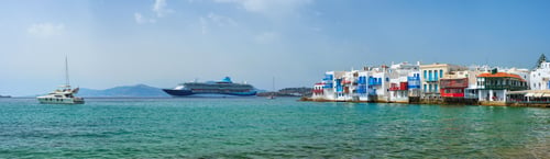 Preview: Little Venice houses in Chora Mykonos town with yacht and cruise ship. Mykonos island, Greecer