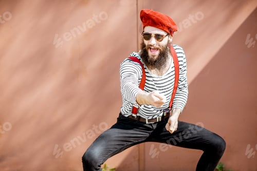 Preview: Portrait of a stylish man on the red background