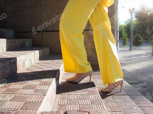 Preview: up the stairs in heels, bright yellow,ease of gait, female gait