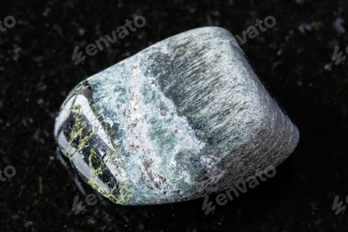 Preview: sample of polished richterite mineral on black