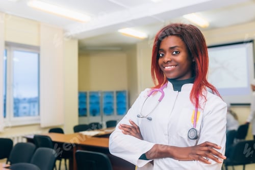 Preview: Portrait Of young afrocan-american Female Doctor In Doctor's Office