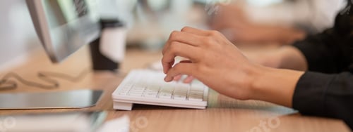 Preview: Closeup business people hands typing on computer keyboard