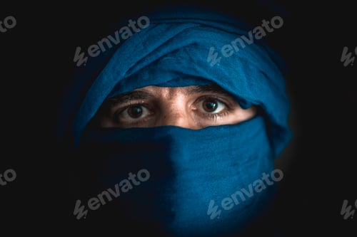 Preview: Simulation of a Berber covered in blue cloth in the desert of Merzouga in Morocco