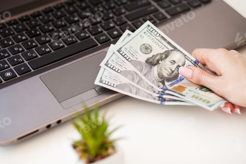 Preview: Close up of woman hand counting US Dollars