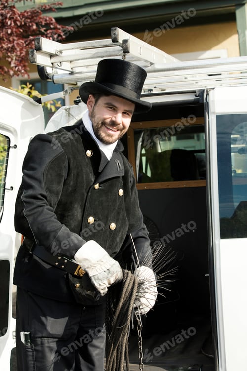 Preview: Portrait of smiling chimney sweep at his van