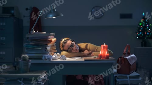 Preview: Exhausted businesswoman sleeping on the desk at night