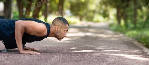 Preview: Serious strong african american man standing in plank position at park at morning, profile, panorama