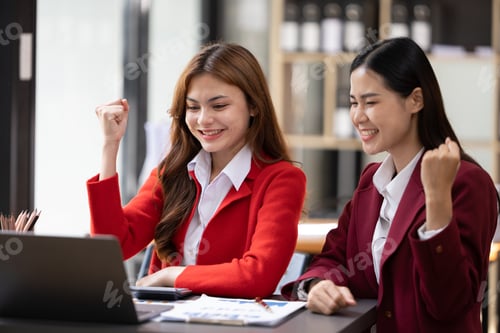 Preview: Excited concept, Happy young woman high fiving with colleague in office.