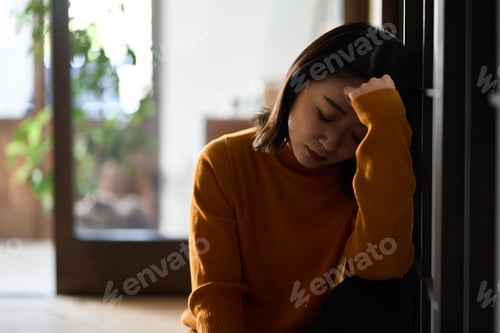 Preview: Anxious and depressed Asian woman