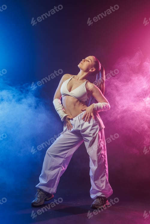 Preview: Neon hip hop jazz funk dance pose in blue and pink smoke studio lighting