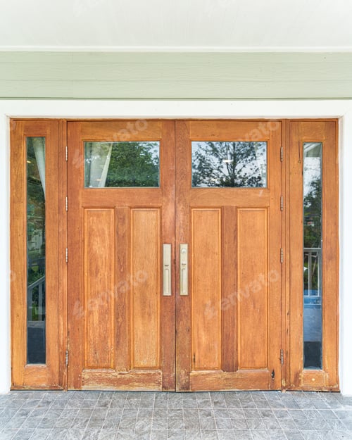 Preview: Traditional wooden double entry door with vertical panels and glass insert on white wall facade