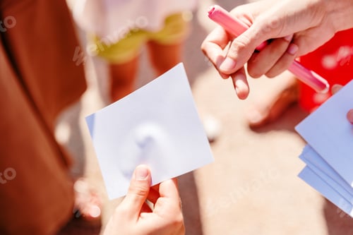 Preview: Two people exchange a blank card, with empty space.