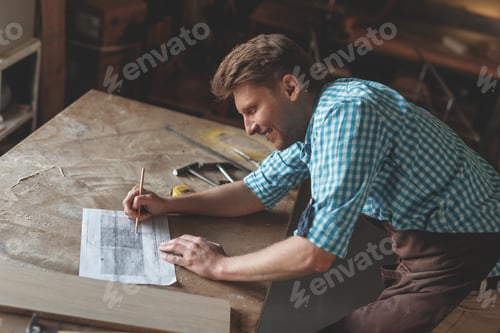 Preview: Smiling man in uniform in carpentry