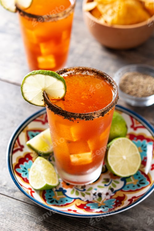 Preview: Homemade michelada cocktail with beer, lime juice,hot sauce,salted rim and tomato juice