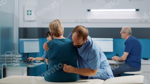 Preview: Male osteopath and old patient doing physical cracking bones exercise