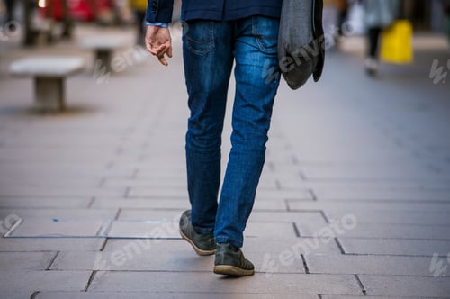Preview: Unrecognizable manager walking in the street, rear view