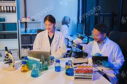Preview: Scientist mixing chemical liquids in the chemistry lab.
