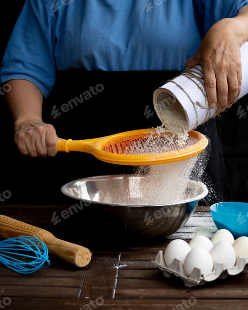 Preview: Non-standard use of a tennis racket as a sieve for sifting flour. Creative way of looking at things.