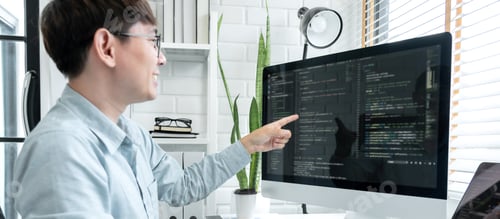 Preview: Male programmer pointing on screen and programing to developing program app and website of corporate