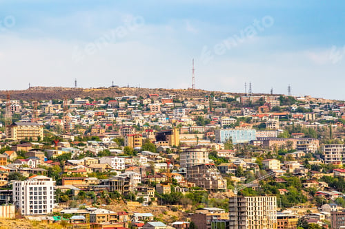 Vista previa: houses in Yerevan city illuminated by setting sun