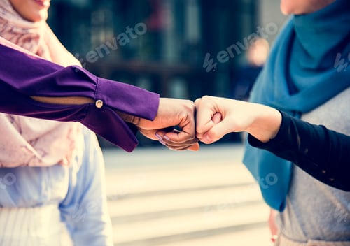 Preview: Islamic women friends fist bumps
