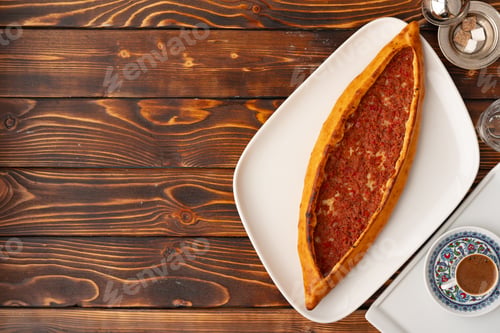 Preview: Pide - Turkish baked bread on wooden table
