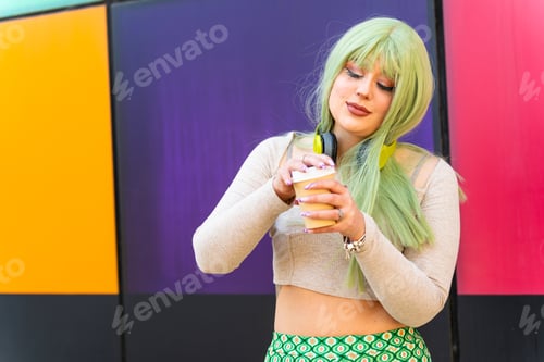 Preview: Modern girl with green hair drinking in cafe at university