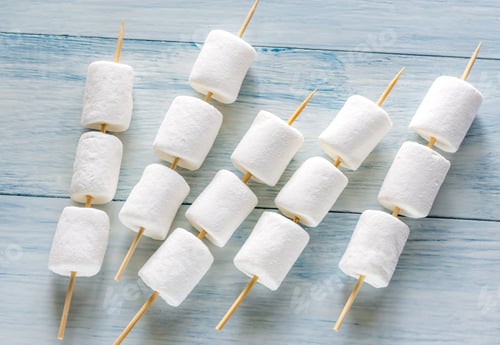 Preview: Marshmallow skewers on the wooden background