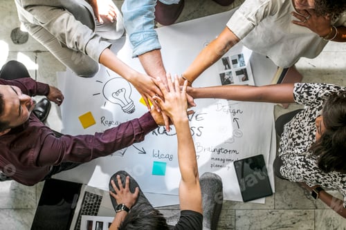 Preview: Diverse startup business team stacking hands