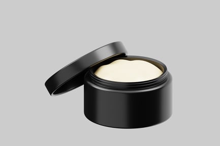 Preview: Open black cosmetic jar with cream