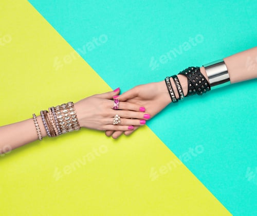 Stylish Jewelry and Pink Manicured Hands on Background