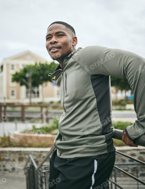 Preview: Fitness, relax or tired black man on a break in running training, exercise or workout in city of Mi