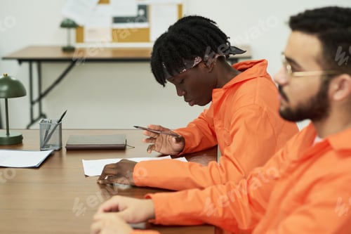Preview: Two Young Inmates Studying Together in Prison Classroom