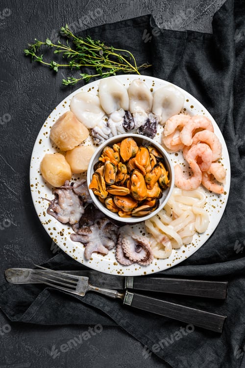 Preview: Steamed seafood mix, sea cocktail. Black background. Top view