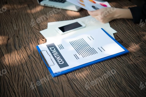 Preview: business woman working with documents graphs ,analyzing investment chart working in office.