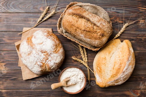 Preview: Homemade natural breads. Different kinds of fresh bread as background, top view with copy space