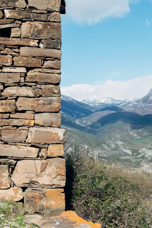 Preview: Photograph of set of snowy mountains in a valley.