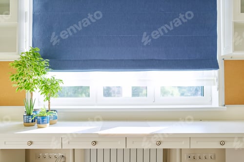 Preview: Interior of room, workplace near window, furniture, desk, blue roman blind, wall shelves