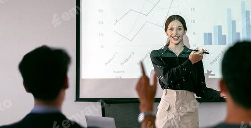 Preview: Businesswoman presenting annual reports of the successful business company in meeting room.