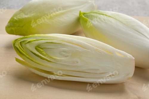 Preview: Whole and half fresh raw Belgian endive