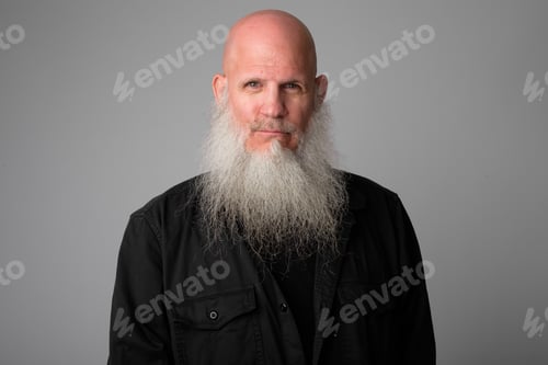 Preview: Face of mature handsome bald man with long beard
