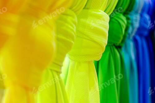 Preview: Bright multicoloured folded textile sheets